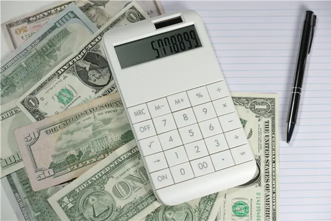 Money with calculator, pen and notepad