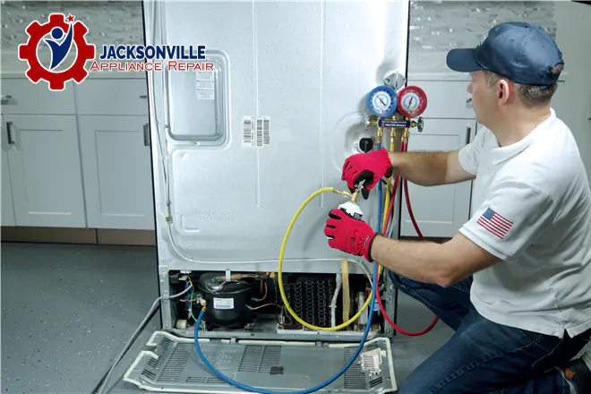 The technician is repairing the refrigerator